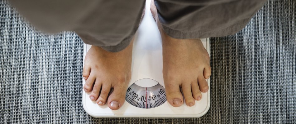 Woman standing on a scale